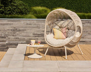 Nuna Egg Lounge Chair outdoor woven lounge chair in modern garden setting – Suns Lifestyle