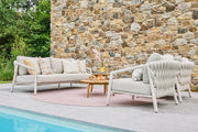 Sato Sofa Collection outdoor lounge set with woven armchairs and sofa on covered terrace – Suns Lifestyle