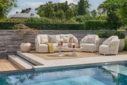 Vivaro Sofa Collection Camel Sand outdoor sofa set by the pool on modern terrace – Suns Lifestyle