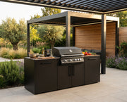 Outdoor grill setup with a pergola in a garden setting